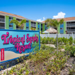 Tropical Sands--Daytime Views Sign